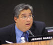 Photograph: [Jerome Garza speaks at a meeting]