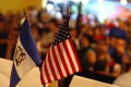 Photograph: [Two Flags decorate a table at the El Salvador Restaurant]