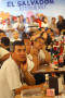 Photograph: [Men listen to a speaker in the El Salvador Restaurant]