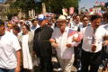 Photograph: [Protesters with priest]