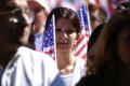 Thumbnail image of item number 1 in: '[Woman protester holds an American flag]'.
