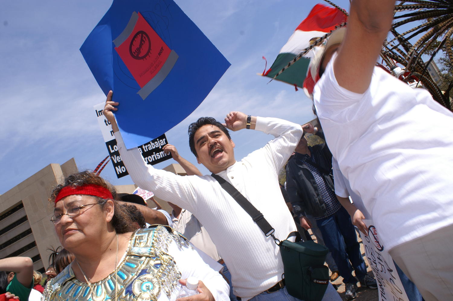 [Protesters hold up signs and a Mexican flag]
                                                
                                                    [Sequence #]: 1 of 1
                                                