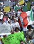 Thumbnail image of item number 1 in: '[Protesters carry signs and a Mexican flag]'.