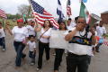 Photograph: [Group of Protesters With Flags, Sign, and Megaphone]