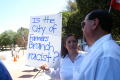 Primary view of [Protester holding a sign, "Is the city of Farmers Branch racist?"]