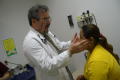 Thumbnail image of item number 1 in: '[Dr. Henry Lenk feels a female patient's face]'.