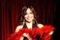 Photograph: [Woman plays with feather boa]