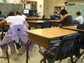 Thumbnail image of item number 1 in: '[Absent students are represented by their empty desks]'.