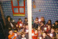 [Teachers and students point flashlights at possible dangers in a home safety demonstration]