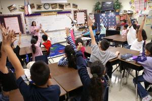 Primary view of object titled '[Delisse Hardy leads a third grade class at Crockett Elementary]'.