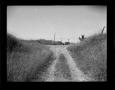 Photograph: [Photograph of Dirt Road Intersection]