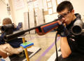 Photograph: [Members of the Air Rifle Team during practice]