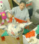 Photograph: [Woman decorates a piñata]