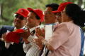 Primary view of [Group of five people with red hats]
