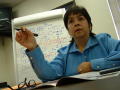 Primary view of [Elizabeth Lopez pointing with pen in right hand]