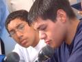 Photograph: [Two young men speaking into microphone]