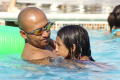 Photograph: [Man and girl in swimming ppol]