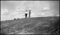 Photograph: [Photograph of Two Men Standing on a Hill in Enchanted Rock]