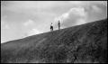 Photograph: [Photograph of Two Men Standing on a Rock]