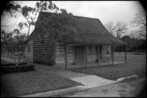 Primary view of object titled '[Photograph of a Cabin in Fredericksburg]'.