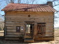 [Photograph of Davis-Ansley Log Cabin Home]