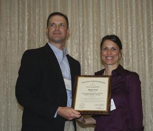 Primary view of object titled '[Raelynn Deaton accepts award from Craig Bonds at the 2012 annual meeting banquet]'.