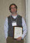 Photograph: [William E. Smith with scholarship award at the 2012 annual meeting b…