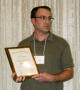 Photograph: [Matt VanLandeghem with scholarship award at the 2012 annual meeting …