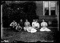 Photograph: [family group by their house]