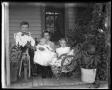 Photograph: [four children on porch]