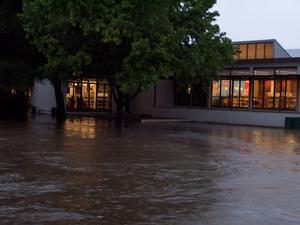 Primary view of [Photograph of Flood waters at the Denton Public Library, Emily Fowler Central Library]