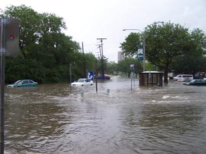 Primary view of [Photograph of Floodwaters on Oakland Street in front of the  Denton Public Library, Emily Fowler Central Library]