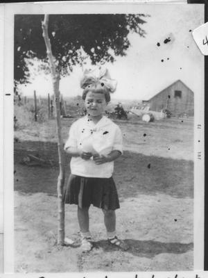 Primary view of object titled '[Unidentified Child near Wood Goin's barn]'.