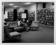 Photograph: [Visitor Reading at Helen Hall Library]