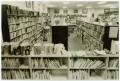 Photograph: [Overcrowded Library Bookshelf]