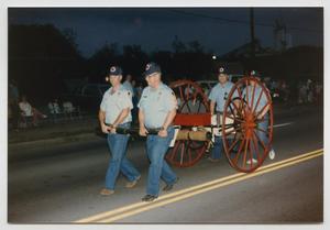 Primary view of [Hand Drawn Hose Reel Wagon in a Parade]