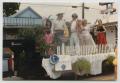 Photograph: [Costumed People on a Parade Float]
