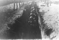 Photograph: French Soldiers Advancing Through Trenches During WWI