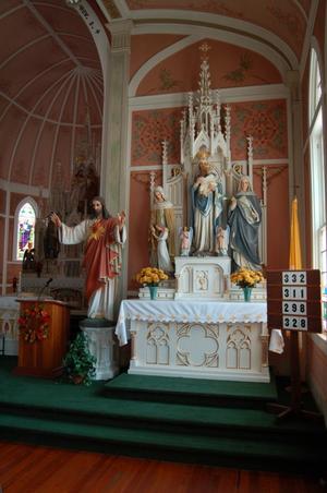 Primary view of object titled 'St. John the Baptist Catholic Church, interior of sanctuary, detail of reredo'.