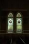 Primary view of St. John the Baptist Catholic Church, detail of arched stained glass windows
