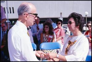 Primary view of object titled '[Claudia Ball and H. B. Zachry at Opening Ceremony]'.