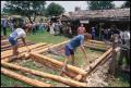 Photograph: [Construction of a Log House]