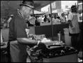 Photograph: [Man Cooking in Soul Food Booth]