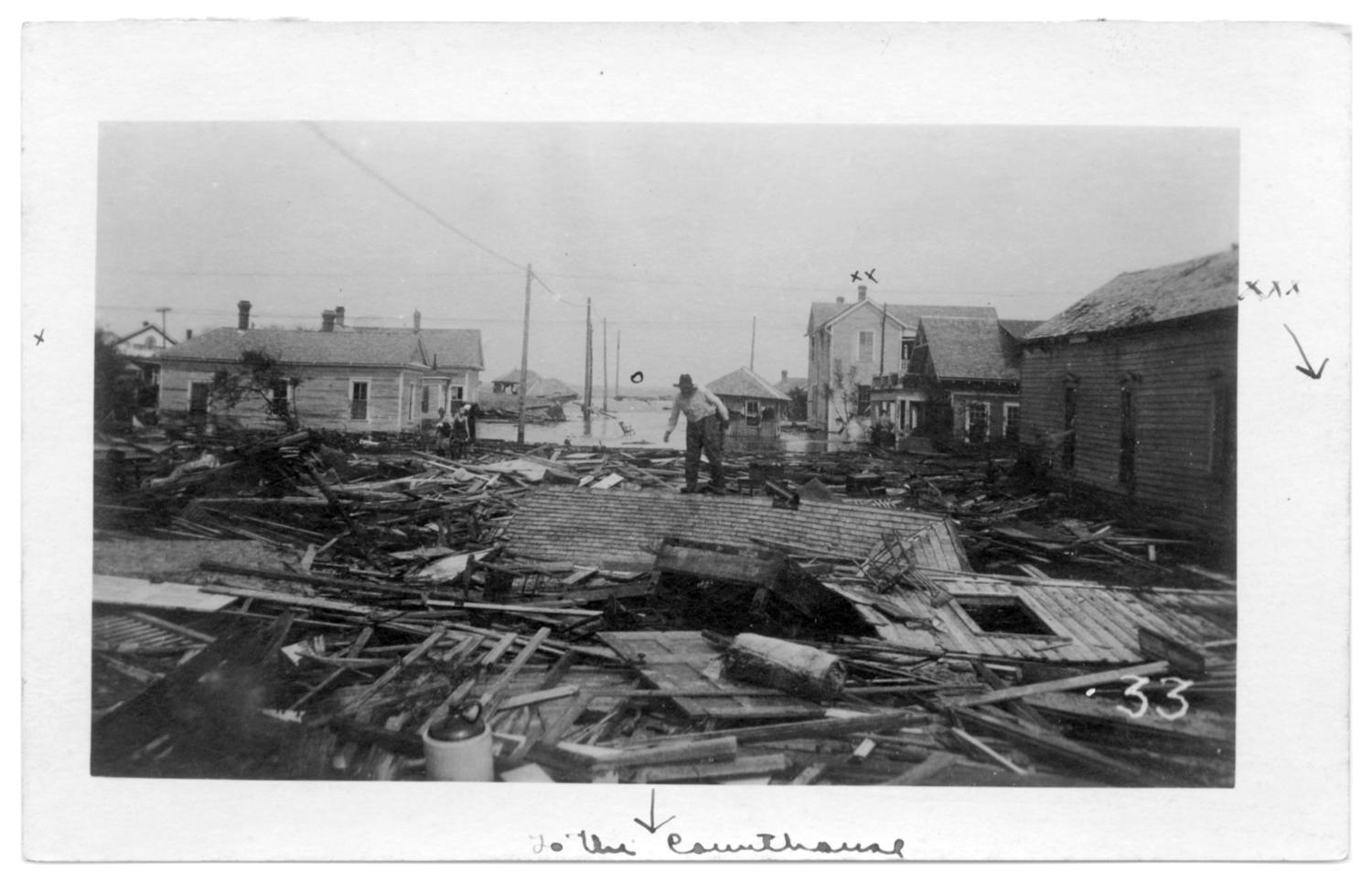 [Photograph of Hurricane Wreckage North of the Courthouse]
                                                
                                                    [Sequence #]: 1 of 2
                                                