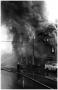 Photograph: [The Damron Hotel Fire, 19 of 21, Two People Looking South from North]