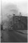 Thumbnail image of item number 1 in: '[The Damron Hotel Fire, 9 of 21:   Firemen and a Fire Truck Near the North Side of Budiling]'.