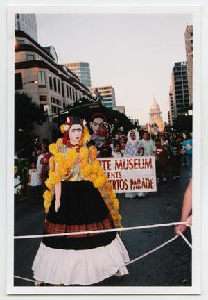 Primary view of object titled '[Banner in Día de los Muertos Parade]'.