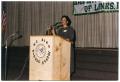 Photograph: [Woman Speaking at Martin Luther King Middle School Ceremony]