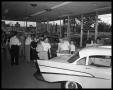 Photograph: Showroom with crowds, 5th & Lamar