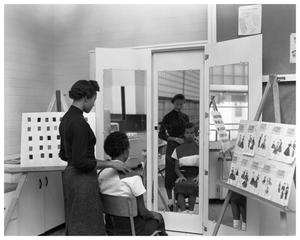 Primary view of object titled '[Anderson High School Student in Beautician Class]'.